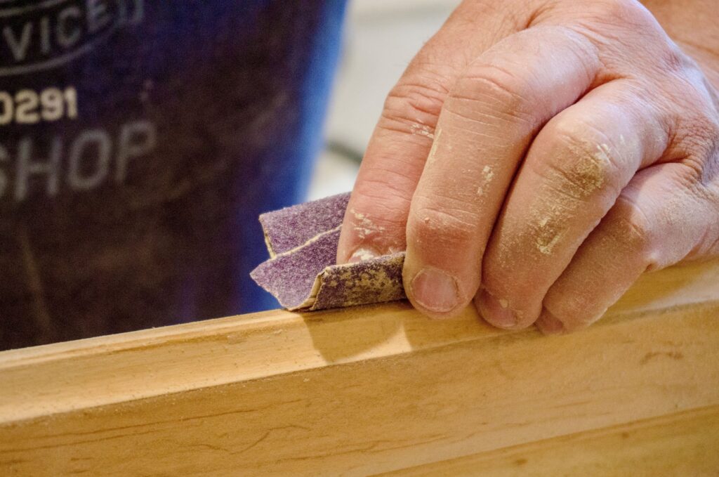 closeup-of-manually-sanding-of-wood-with-sandpaper-2022-11-16-00-05-02-utc-1024x6791.jpg